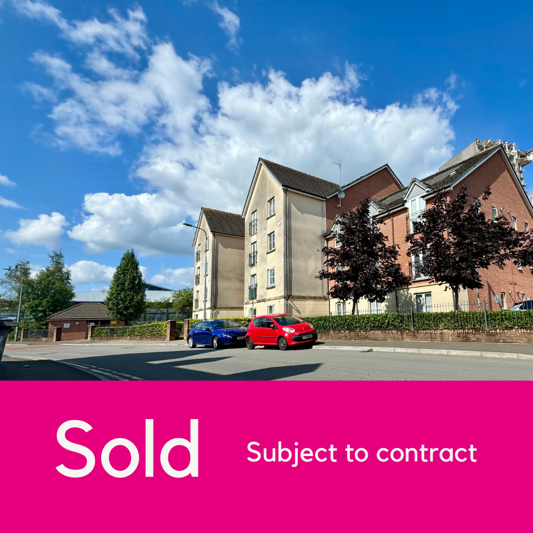 Photograph of 39 Ashbourn Way with pink block that has white text that reads 